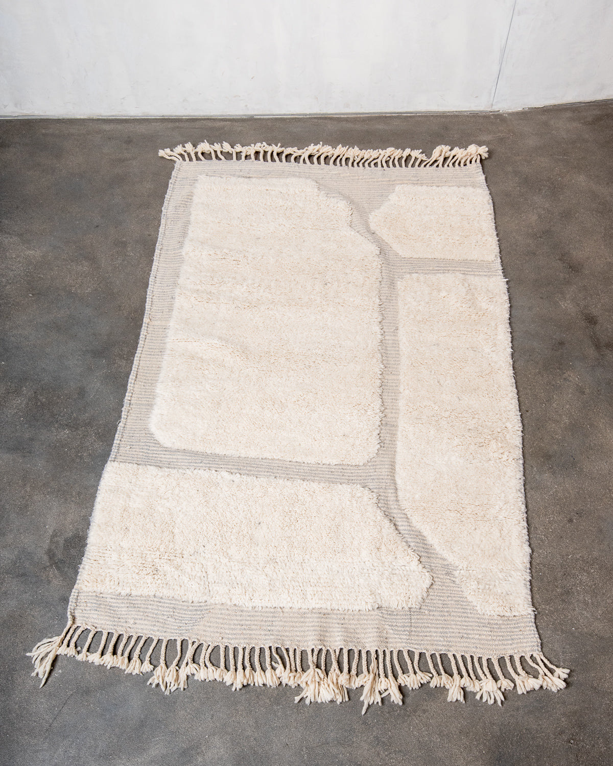 Modern, designer, handcrafted Berber rug from Morocco. Beniourain carpet with beautiful colours and patterns and fluffy wool texture.